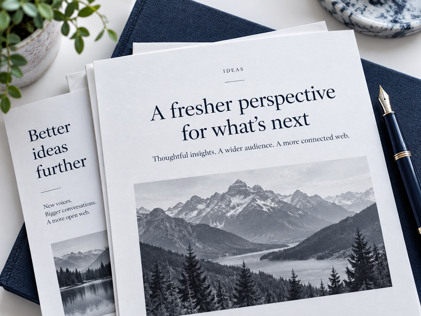 Editorial article pages and publishing materials on a desk